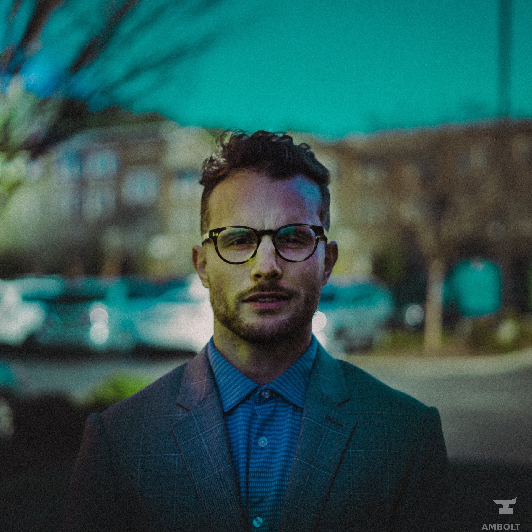 Environmental portrait on a teal-graded street