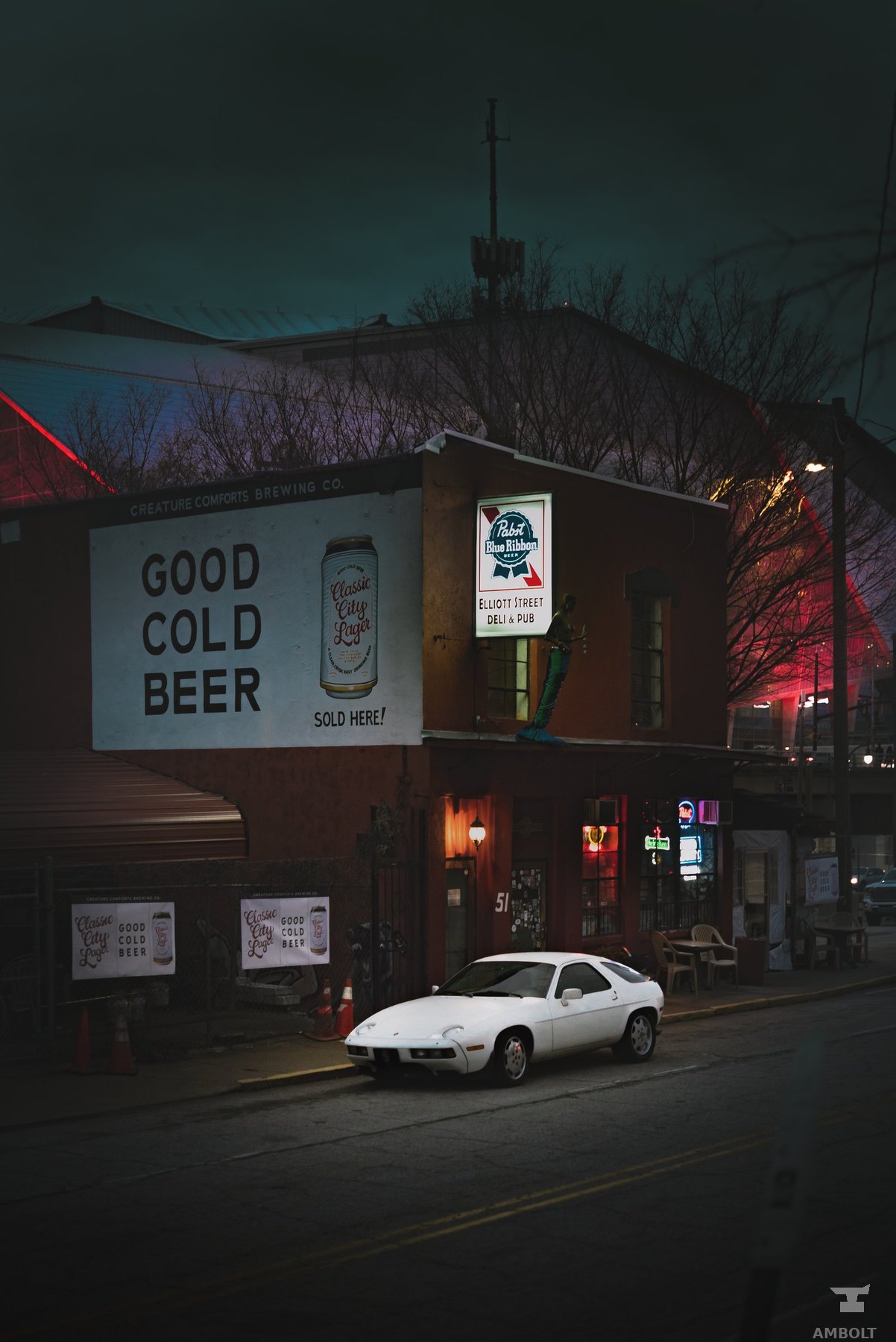 Night street scene with a beer sign