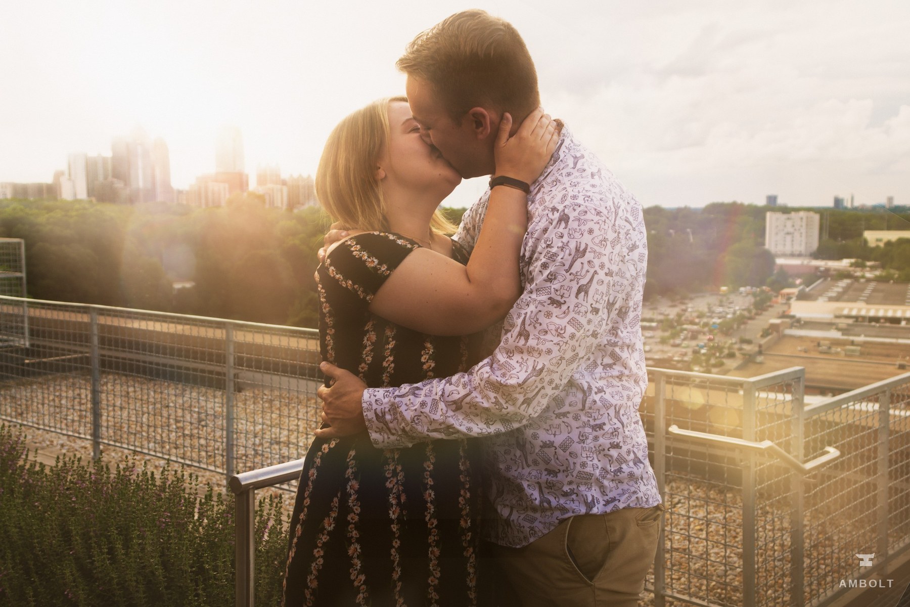 Engagement portrait with skyline behind